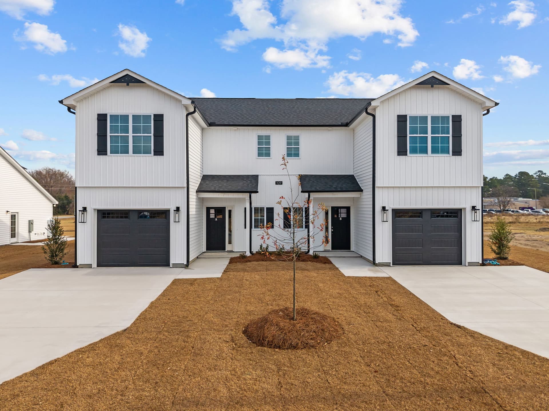 First-time homebuyer holding keys to new home in Greenville NC